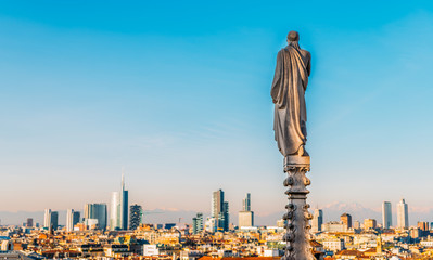 View of Milan's financial district and statues of Duomo of Milan