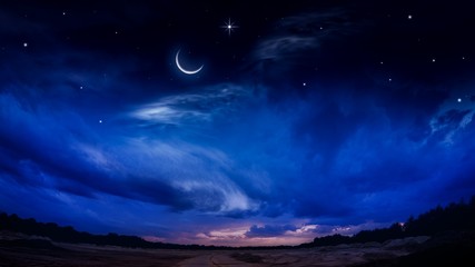 Naklejka na ściany i meble Beautiful dark fluffy cloudy sky with sun rays . Crescent moon with beautiful sunset background . Generous Ramadan . New moon. Prayer time. 