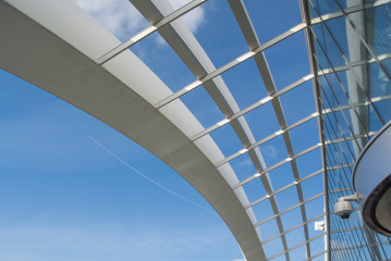 modern office building with blue sky and clouds