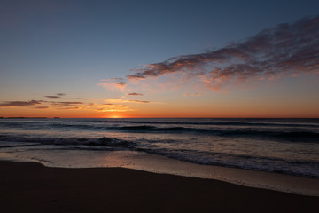Naklejka na ściany i meble Stunning, golden sunrise over Windang Beach, NSW, Australia