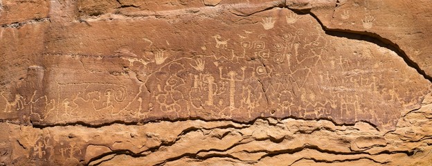 Petroglyphs on rock wall in Media Vera, Colorado