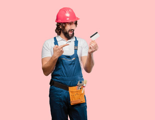 young man worker with a credit card