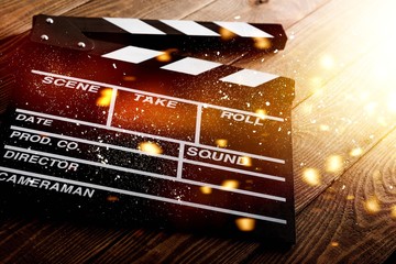 Clap board on wooden background