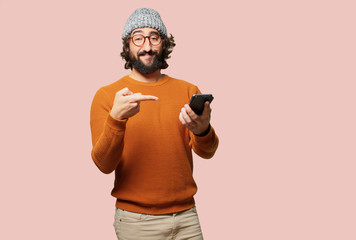 young bearded man with a smart phone