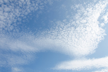 Beautiful cumulus clouds on a blue sky on a sunny day.