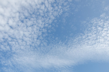 Beautiful cumulus clouds on a blue sky on a sunny day.