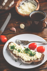 Rye bread toast with processed cheese, garlic and dill