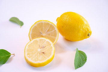 freshCreative layout made of lemon and leaves. Flat lay. Food concept. Lemon on white background