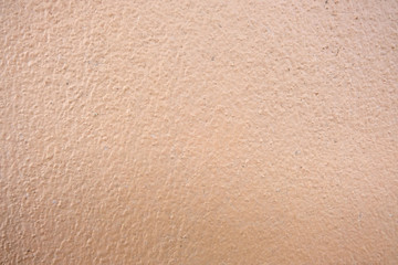 Brown cement wall background close up