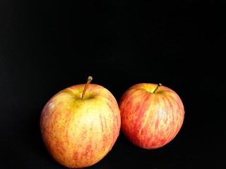 Organic apples from a Guatemalan farm on black background. fruits concept