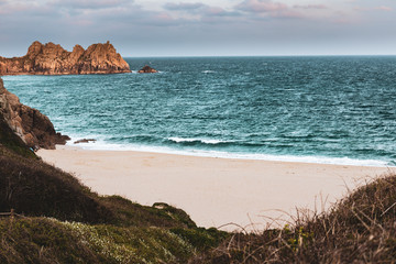 Fototapeta na wymiar Seaside beach coastal with water and waves in Cornwall, England.