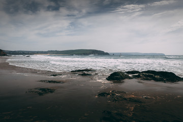 Bigbury Beach with White Waves during high winds in Devon, England.