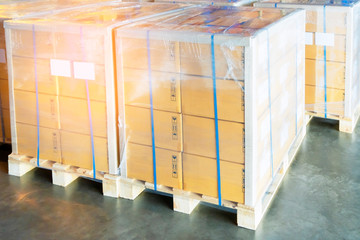stacked of package boxes on wooden pallet cargo export for transportation at distribution warehouse.