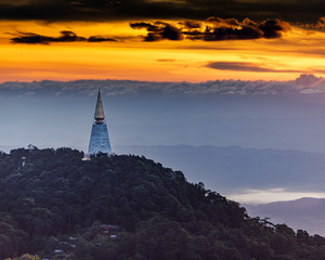 Wat Pa Phu Thap Boek in Phetchabun, Thailand with sunrise and fog in the distance.
