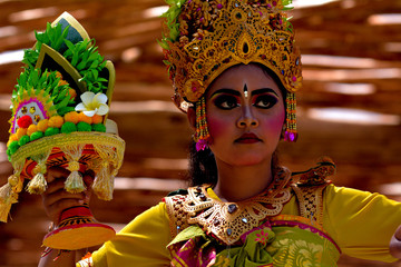 Balinese woman dancing Tari Pendet Dance in Bali Indonesia