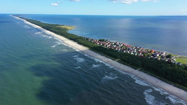 Beach in beautiful city Chalupy resort in Poland. Aerial video. Baltic Sea.Waves coming in.