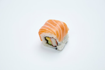 Philadelphia Maki Sushi made of Fresh Raw Salmon on white background.