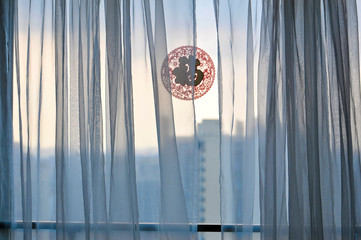 Window with curtains and Chinese paper cutting