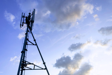 Silhouette of telecommunication tower of 4G and 5G cellular, mobile and internet station tower in sky background.