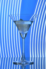 martini glass on backlight background
