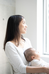 Young mother holding her baby