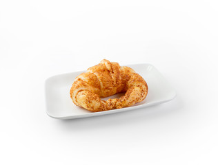 fresh croissant isolate on a white dish on white background