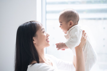 Young mother holding her baby