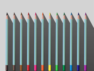 Illustration of a set of 12 primary colors of watercolor pencils on a light gray background with long shadow. Watercolor pencils for drawing, art set for children. Watercolor pencils for creativity.
