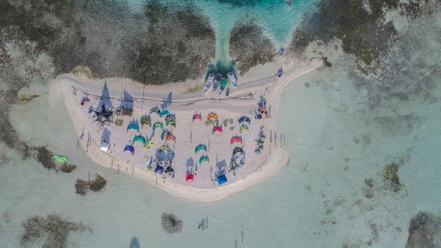 Aerial view island with kiters doing kiteboarding sports on the Caribbean beach f in Los Roques Archipelago Venezuela