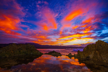 Amazing North Shore Oahu sunset reflected in a tide pool