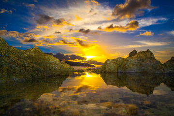 Fototapeta na wymiar Amazing North Shore Oahu sunset reflected in a tide pool