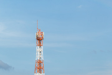 Telecommunication tower on shiny blue sky