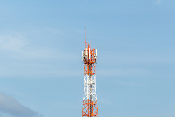 Telecommunication tower on shiny blue sky