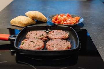 Raw Cutlet meat on the pan. Cooking session shot,