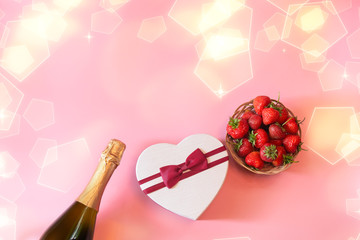Bottle of champagne, heart shape gft box and fresh strawberry on pink background