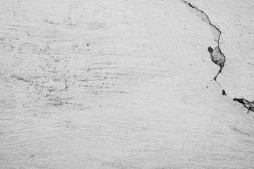 Texture of a concrete wall with cracks and scratches which can be used as a background