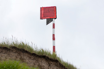 wooden post on the rock. it has