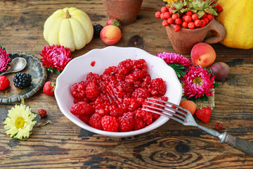 Preparing raspberry preserves. Bowl with ripe fruits.