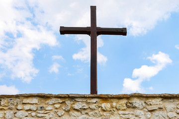 A large wooden cross against the sky.