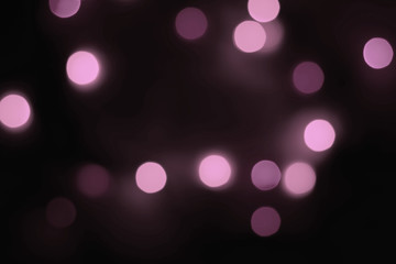 Abstract blur bokeh background. Defocused bokeh colorful background. Soft color blur on a black background. Beautiful colored bokeh lights