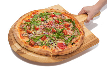 Food service concept - female hand holds a wooden board with pizza on a white background.
