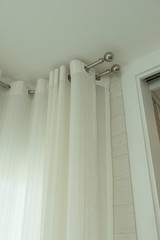 Fototapeta na wymiar Close up of draperies at a window, Curtain glazed sliding doors 