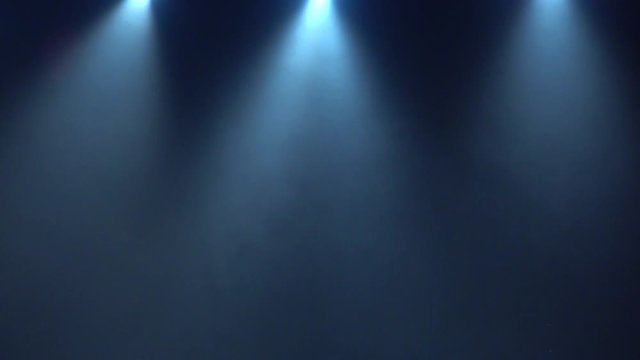 Dark blackboard with three stage lights spotlights with haze