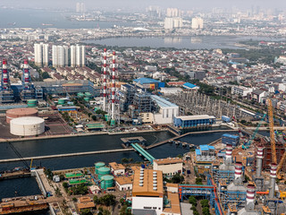 Fototapeta na wymiar Aerial View of Steam Electric Power Station Plant Near The Ocean.