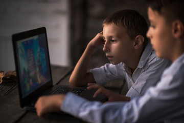 children have fun with a laptop computer