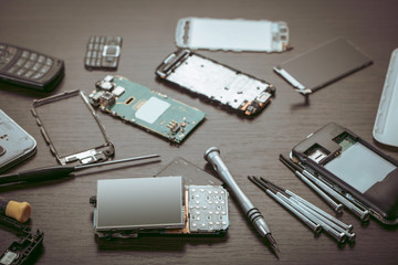 disassembled mobile phone and tools
