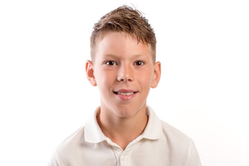 Studio portrait of  9  year old schoolboy on white background