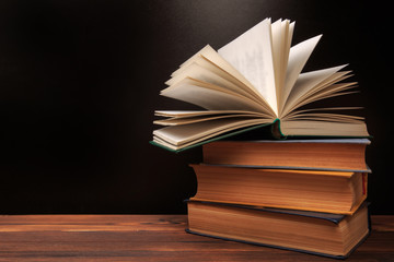 Open book on the blackboard background.