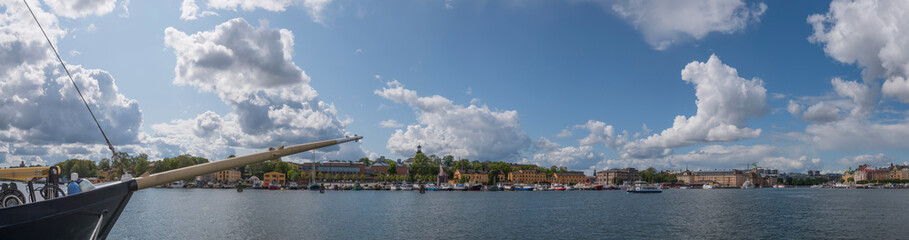 Naklejka na ściany i meble View over the Stockholm waterfront a summer day, with boats and houses. 