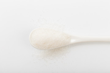 Spoon of fine granulated sugar isolated on white  - Image